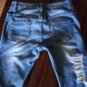 Light blue ripped jeans